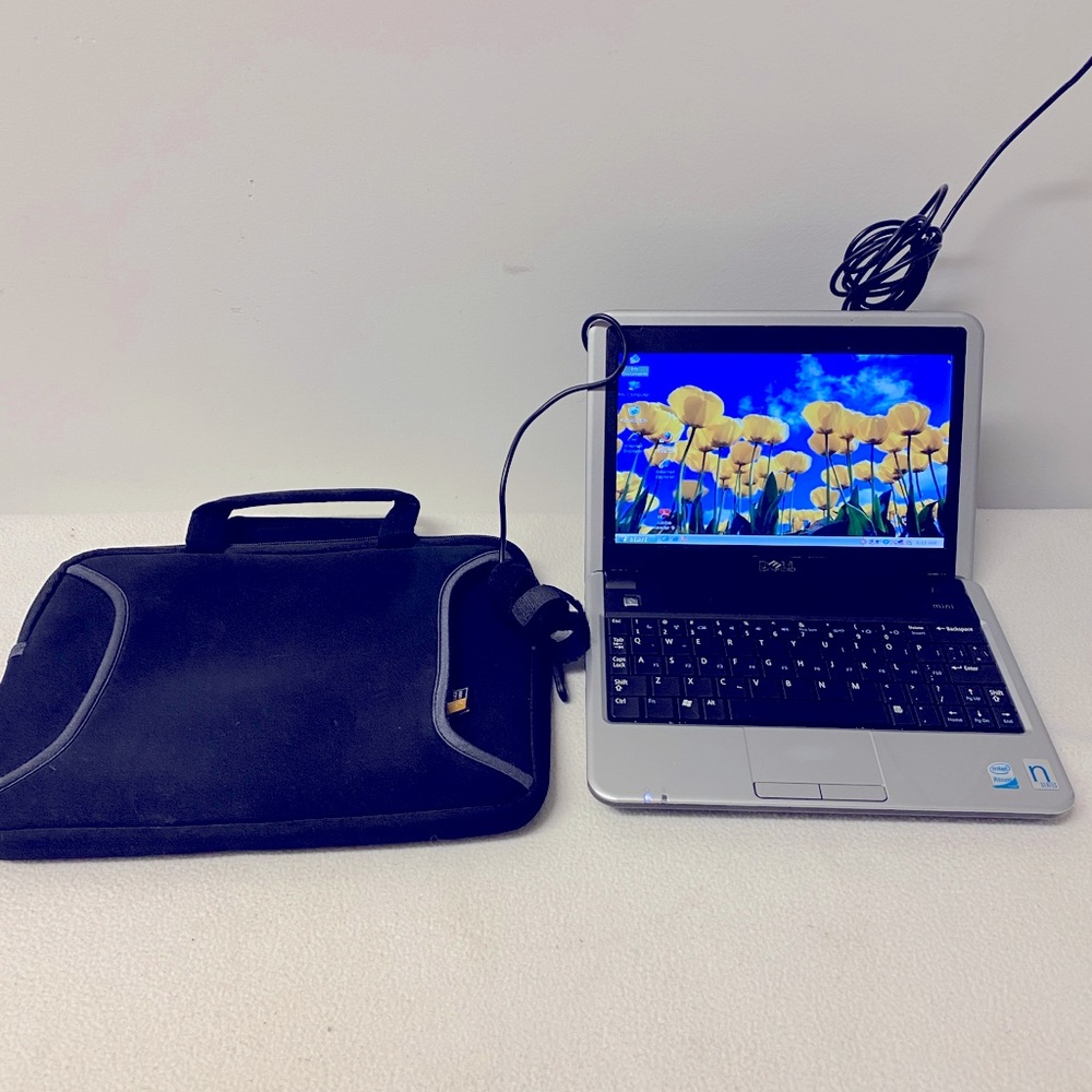 The Dell Inspiron 910, Model PP39S with soft carry case and power cord.